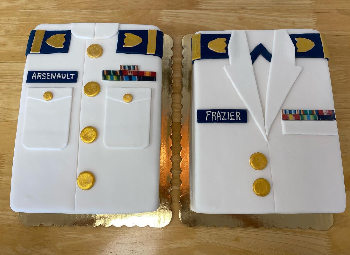 A pair of Coast Guard uniforms for a couple of special graduates! #CoastGuard #USA #uniforms #cake #fondant #customdecorations #thepursuitofpastry #ctbakery #oldsaybrookct