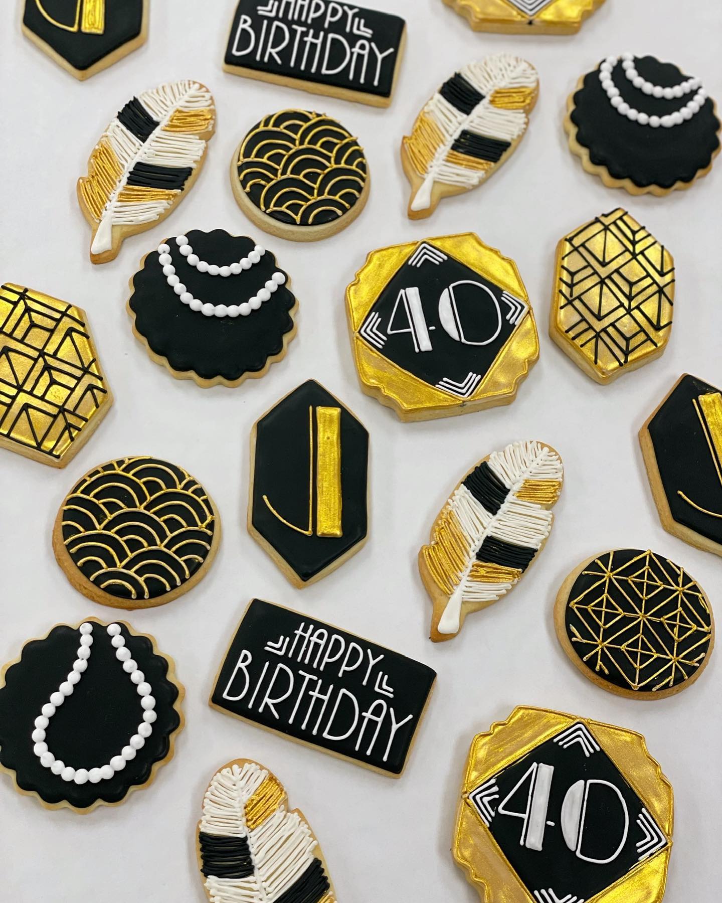 40th birthday celebration cookies! #thepursuitofpastry #ctbakery #oldsaybrookct #customcookies #icedsugarcookies #goldandblack #royalicing
