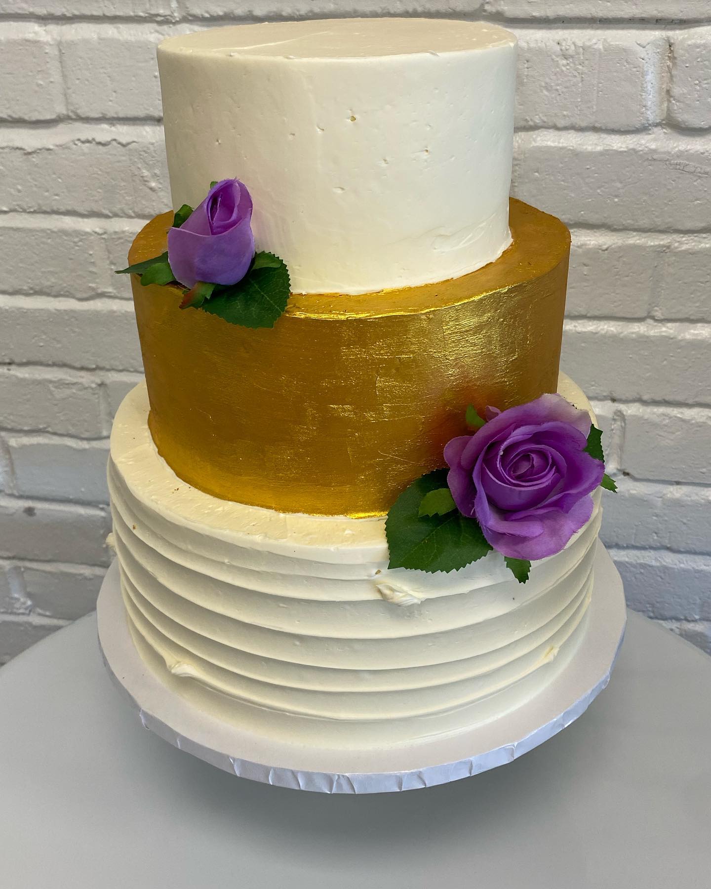 A beautiful 3-tier wedding cake that Courtney did for this past weekend! #weddingcakes #3tierweddingcake #ediblegoldpaint #texturedsides #elegant #love #thepursuitofpastry #ctbakery #oldsaybrookctbakery
